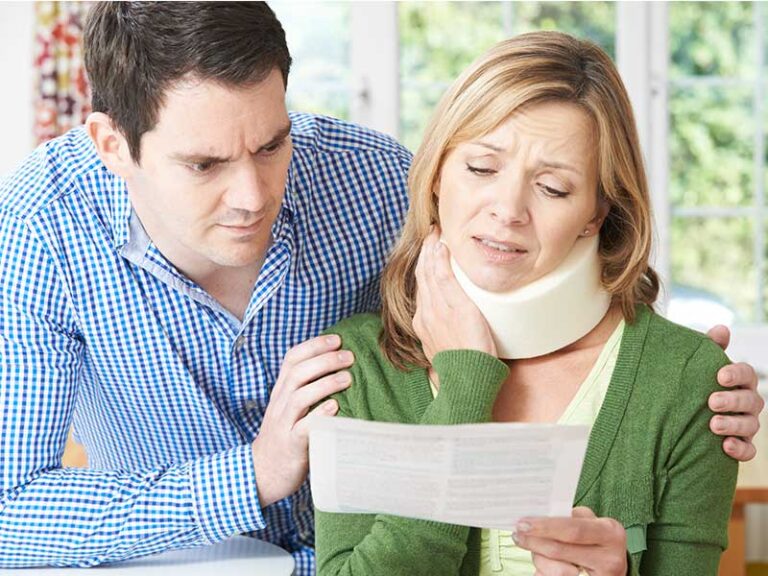 A woman wearing a neck brace looks concerned while reading a document, with a man beside her offering support.